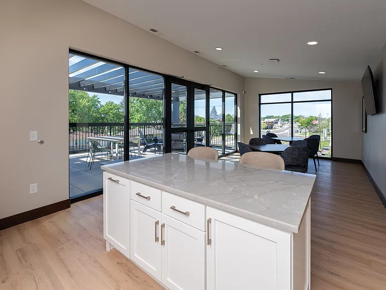 A shared kitchen space located just steps from rooftop BBQ and firepit areas.