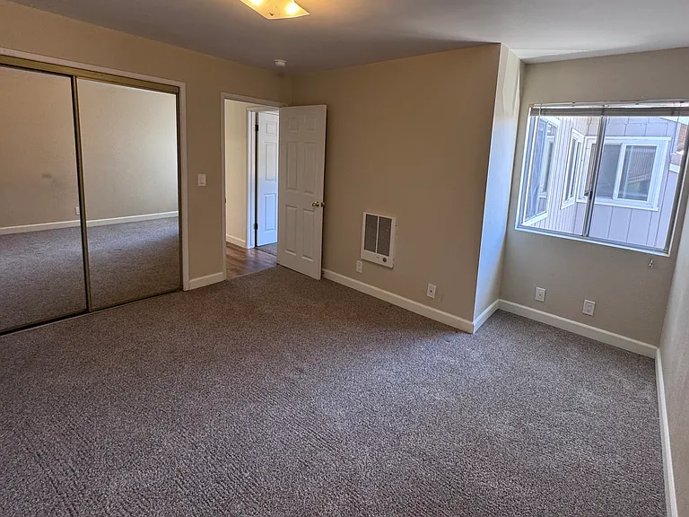 2nd Bedroom with good size step in closet and wall heater.