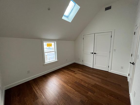 East bedroom with skylight
