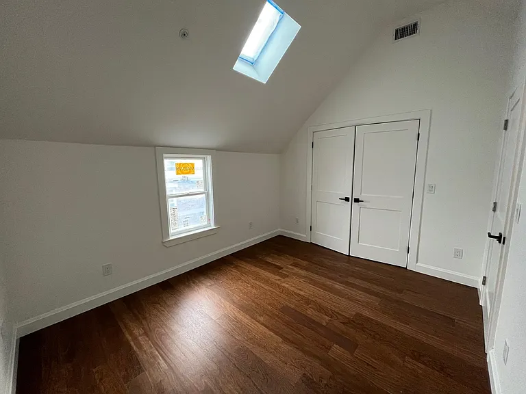 East bedroom with skylight that opens by remote control.