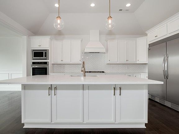 INCLUDED Oversized Fridge and Double Ovens