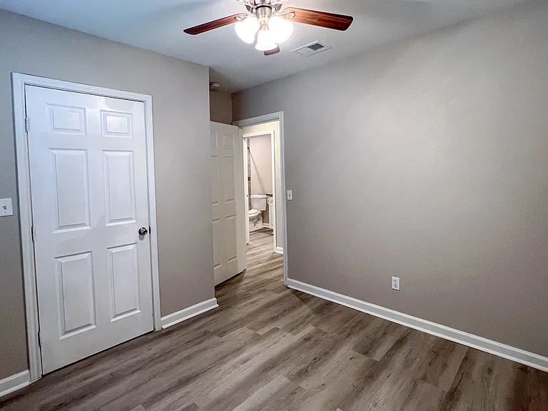 Another view of the second bedroom, showing the closet and easy access to the nearby full bath.