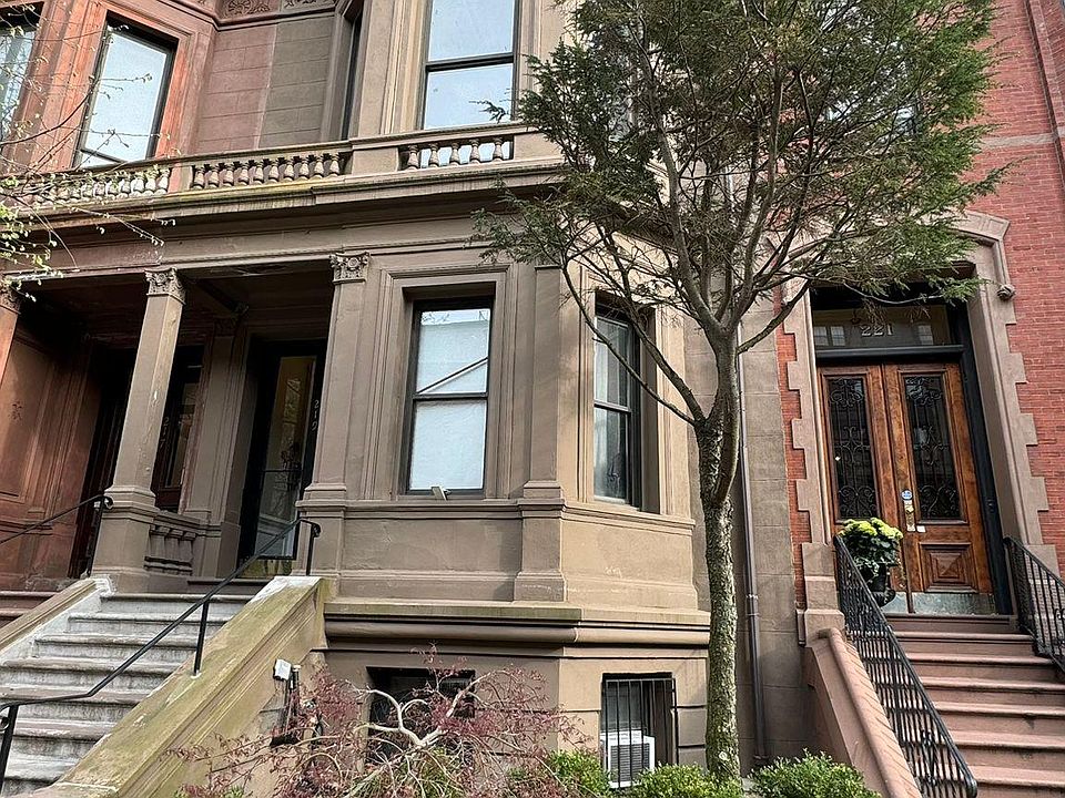 view of the building from Beacon Street, the unit is on the elevated first floor.
