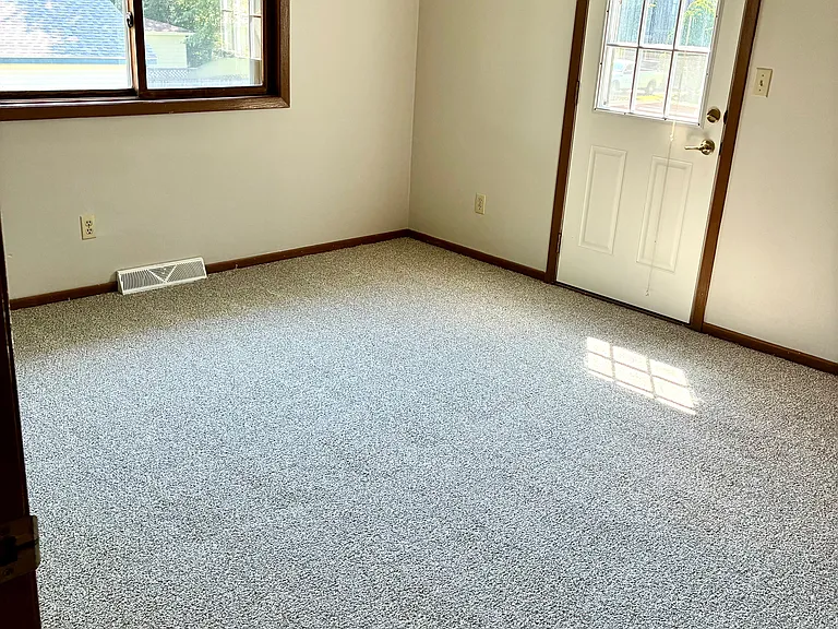 Primary bedroom with patio door