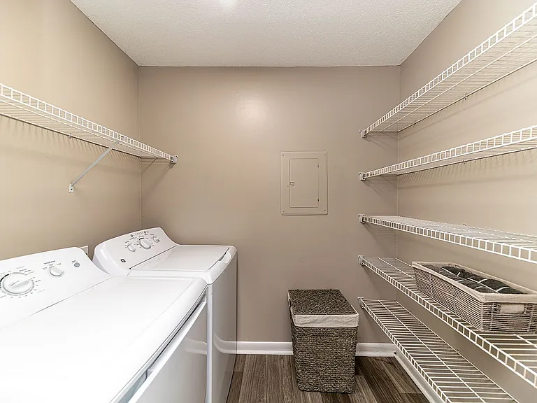 Laundry room with built-in shelving for storage