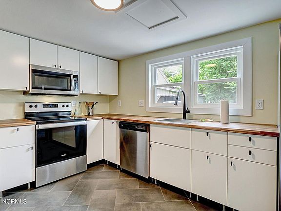 Fully renovated kitchen! Stainless steel appliances, butcher block counters, and soft-close drawers/cabinets.