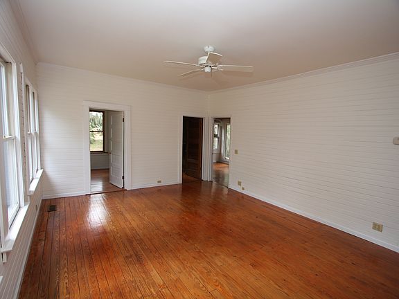 Large master bedroom with walk in closet & private bath with clawfoot tub overlooking the marsh. Large laundry room is located next to the master that would also be a good office area.