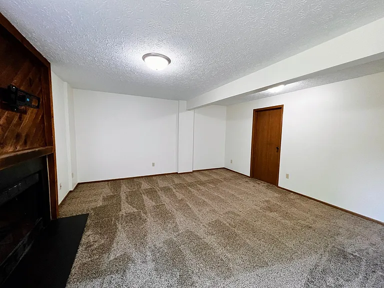 Walkout lower level with woodburning fireplace and a closet. Laundry room access off lower level.