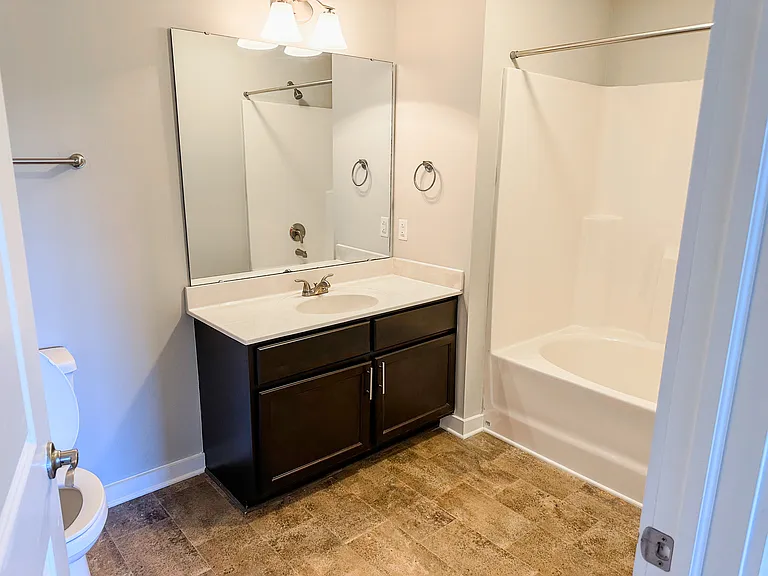 The primary bathroom features a garden tub.