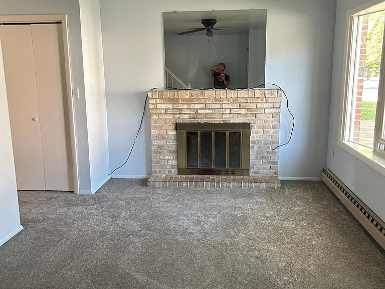 Living Room with large bay window with screens.
