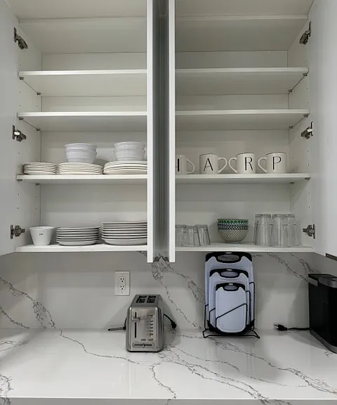 Just a demonstration of fully equipped kitchen. Plates and bowls, cups and glasses, forks and knives,etc.