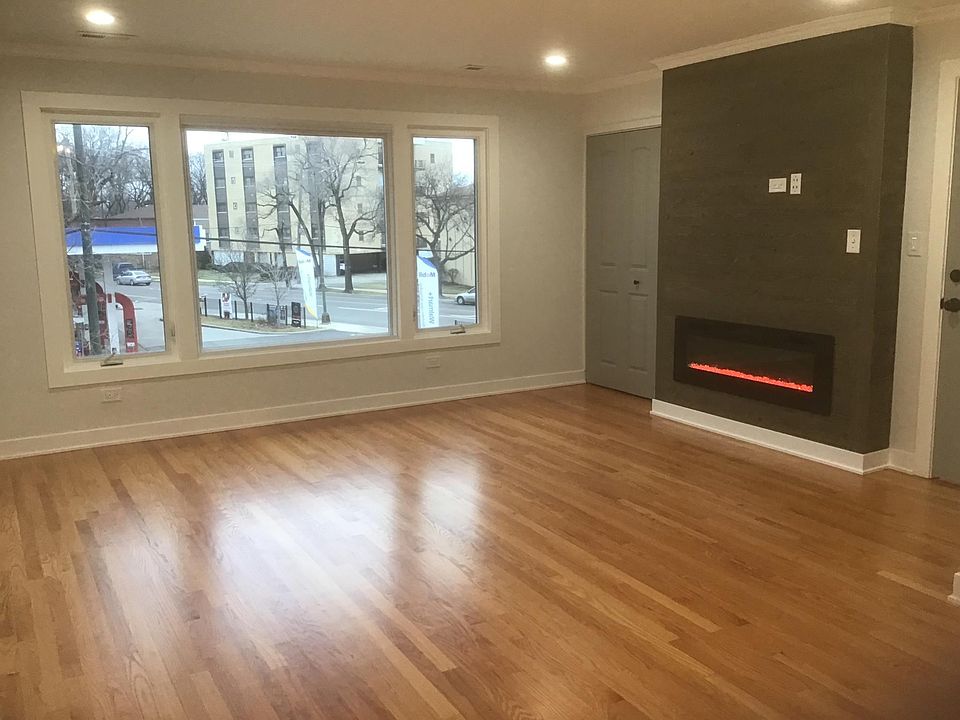 Living room with shiplap fireplace TV connection and coat closet