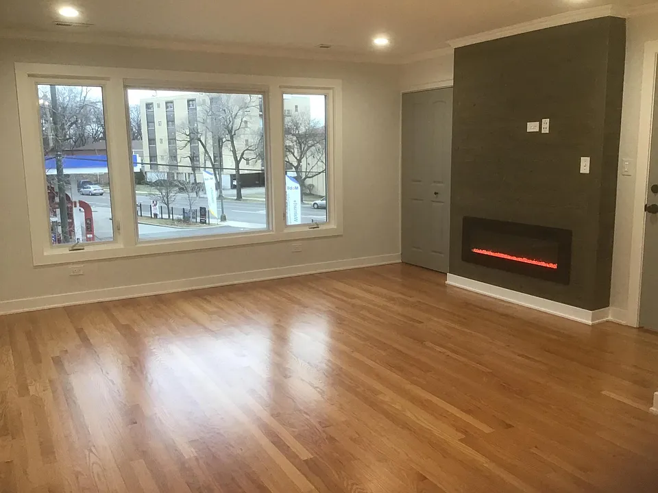 Living room with shiplap fireplace TV connection and coat closet