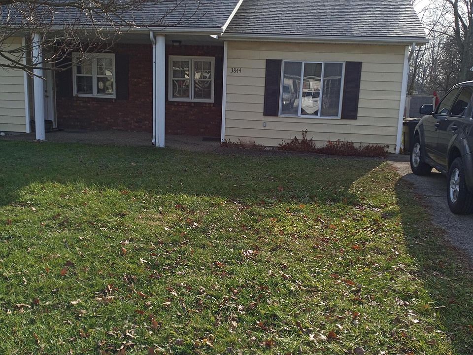 Front of duplex. 3844 is directly in front. Notice the plum tree in front yard. Parking is on the right in the photo.