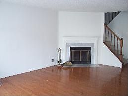 Wood Burning Fireplace with a Marble Surround