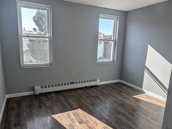 Master Bedroom Window View with Baseboard Heating
