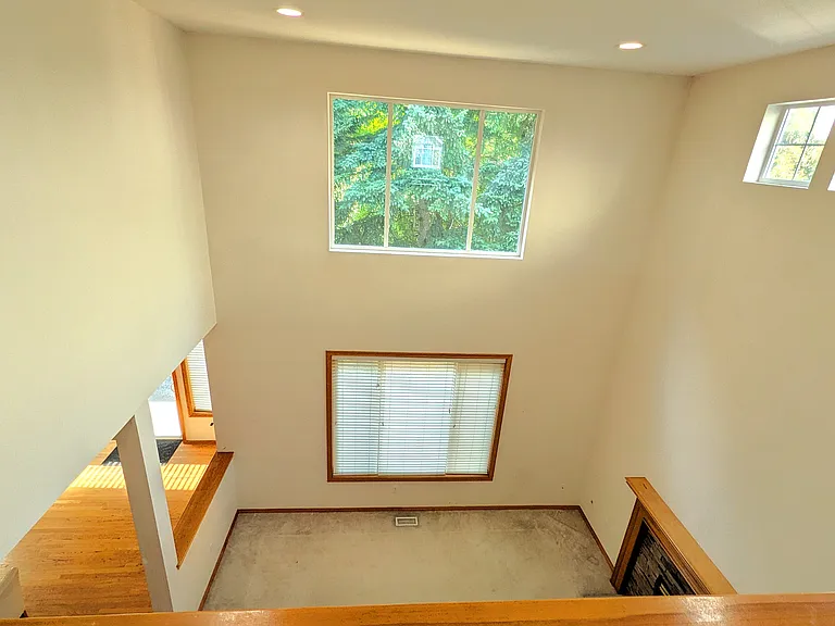 Living room with soaring two story high ceiling