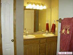 Mather bath has his/her closet, double sink and jet tub