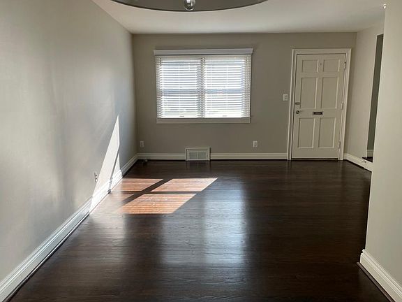 Living room and large window from dining room.