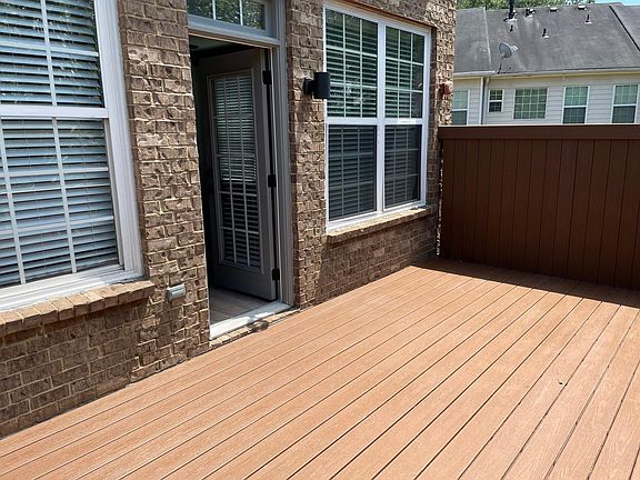 Patio Deck with Privacy Wall Adjacent to Living Room on Level 3