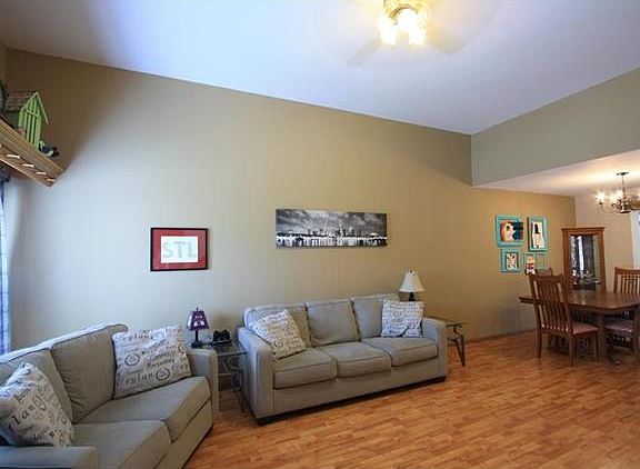 Spacious living room with wood laminate and plenty of natural light.