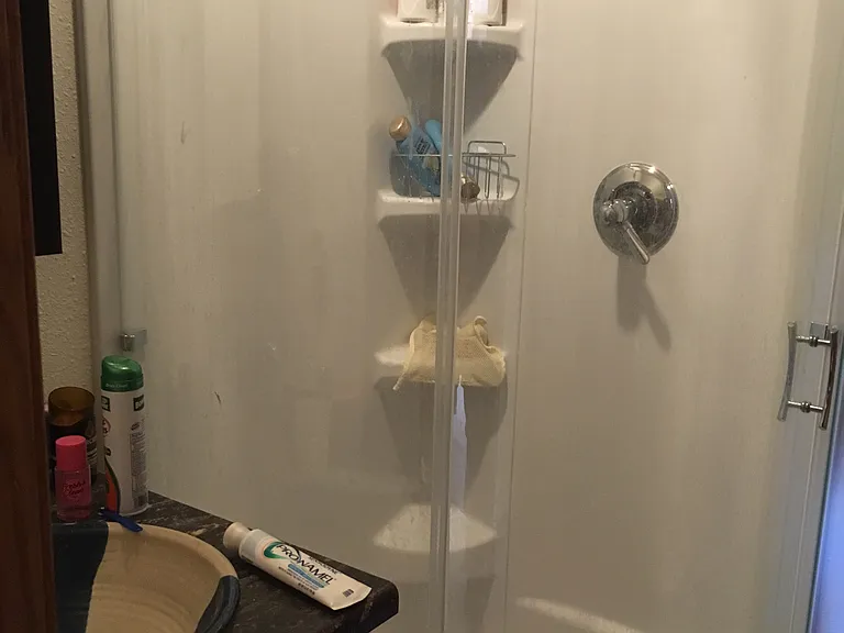West bathroom with sink, shower and toilet