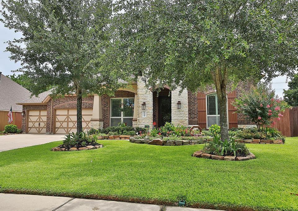 Perfection in the Sanctuary! Stone and brick elevation and beautiful landscaping sets the one for this lovely home