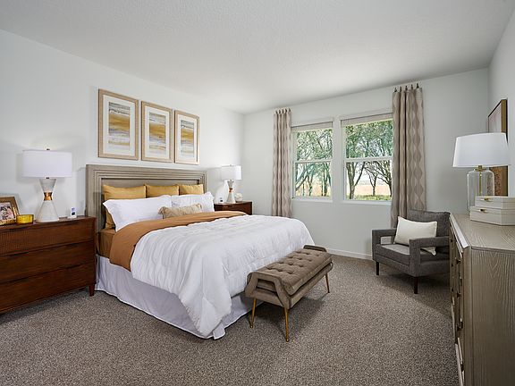 Primary bedroom of the Orchid Plan.