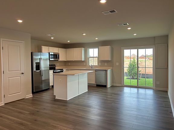 Open concept kitchen, eating area and family room