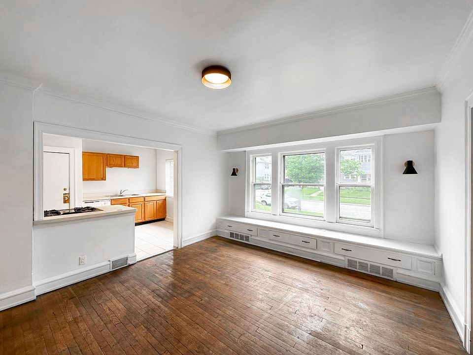 Dining room features large built in bench with new, modern fixtures.