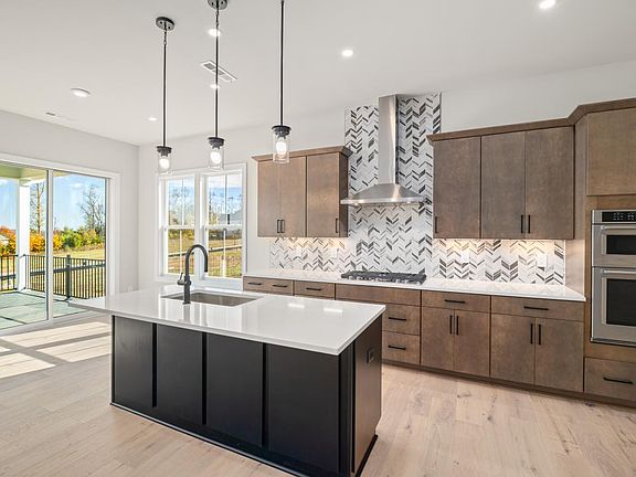 Stunning kitchen with casual dining area that leads out to covered deck