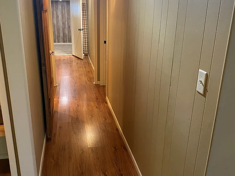 Hallway leading to full bathroom, Master bedroom, guest bedroom and small bonus room.