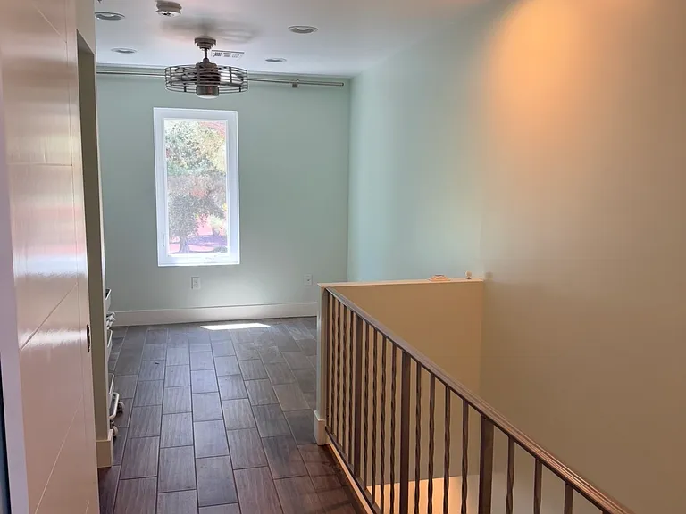 Upstairs hallway walking closer to open concept room, or home office.