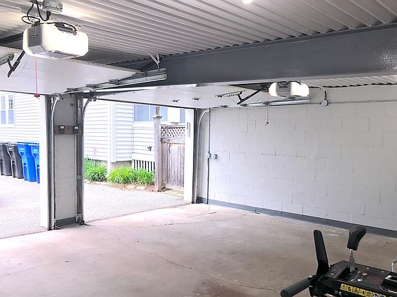 Renovated large garage, with new doors, new lights, and a new coat of paint.