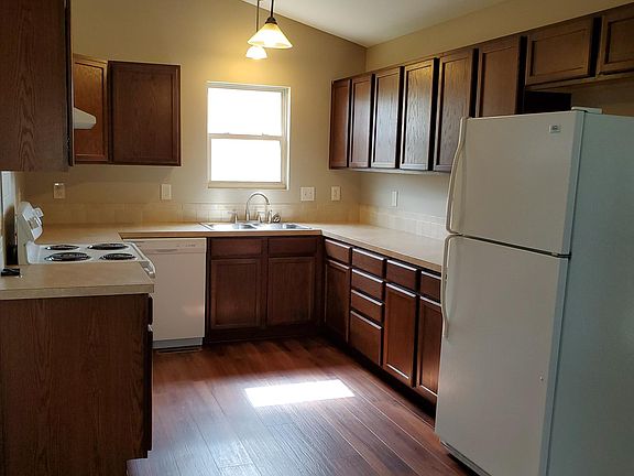 Kitchen includes range, refrig, & dishwasher. Room for dining table.