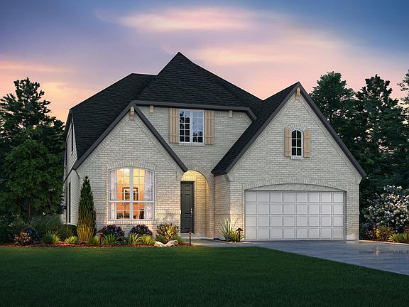 custom home with brick exterior