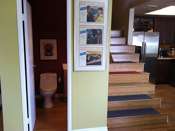 Powder Room, Stairs, and Kitchen on the right