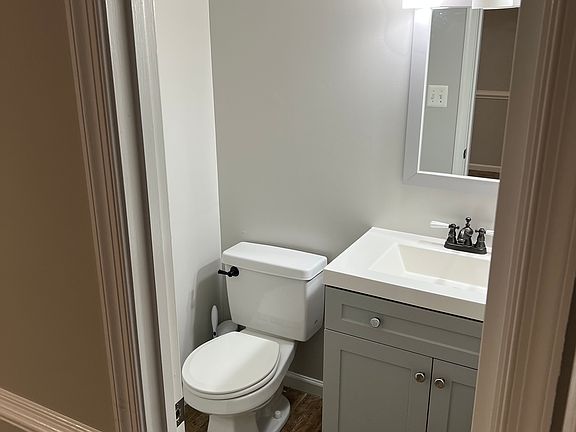Powder Room. 1/2 Bath off transition area from Dining Room to Living Room.