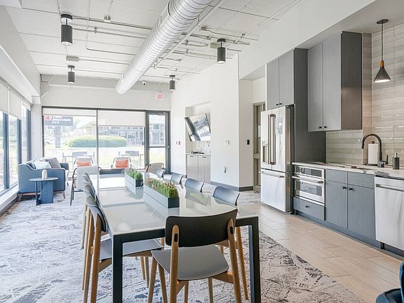 Our entertainment suite features a modern kitchen and dining area, perfect for hosting gatherings.