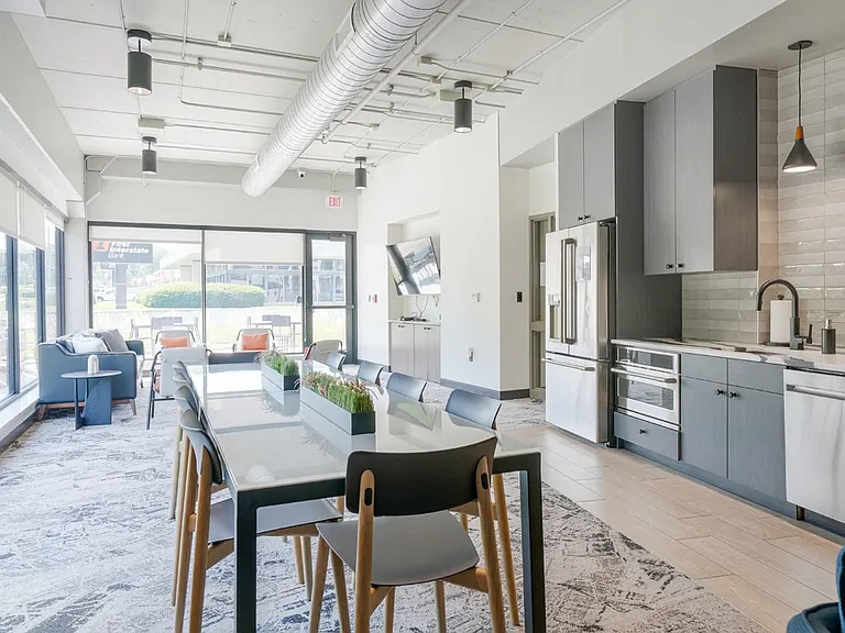 Our entertainment suite features a modern kitchen and dining area, perfect for hosting gatherings.