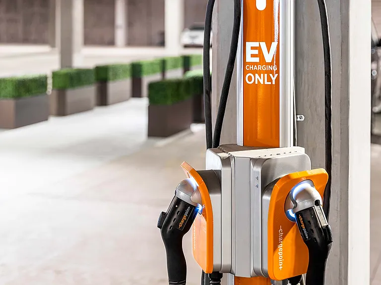 Car charging stations available to residents with electric vehicles.