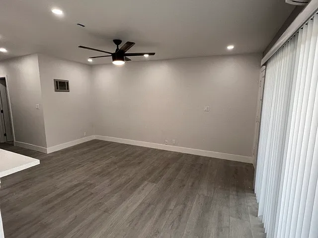 Living room with large sliding glass door opening to the patio