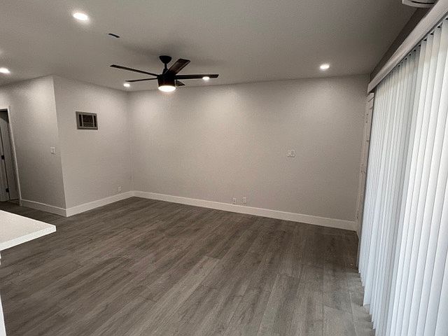 Living room with large sliding glass door opening to the patio