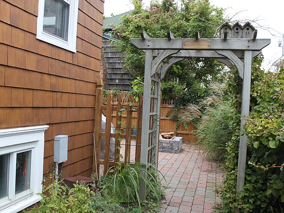 Brick walkway to back yard.
