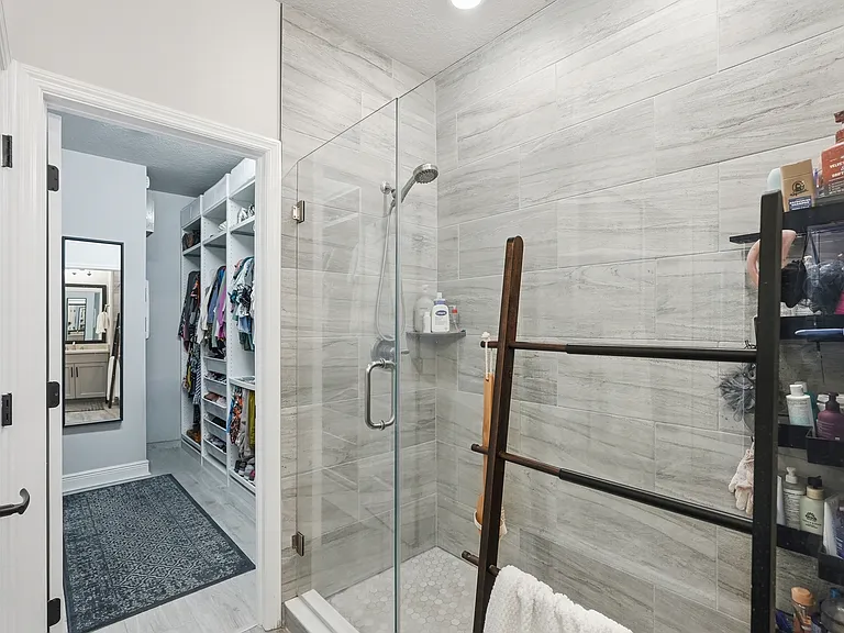 Primary bathroom and oversized walk-in closet