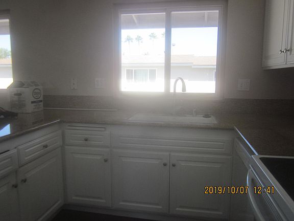 Kitchen sink with new faucet and granite countertops