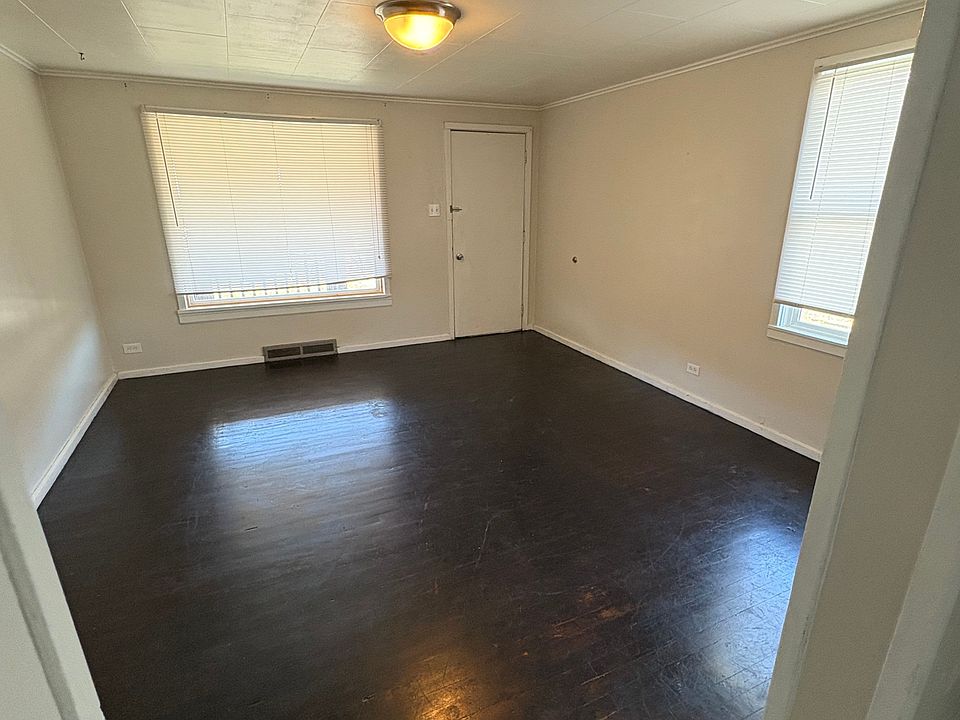Spacious living room with wood floors
