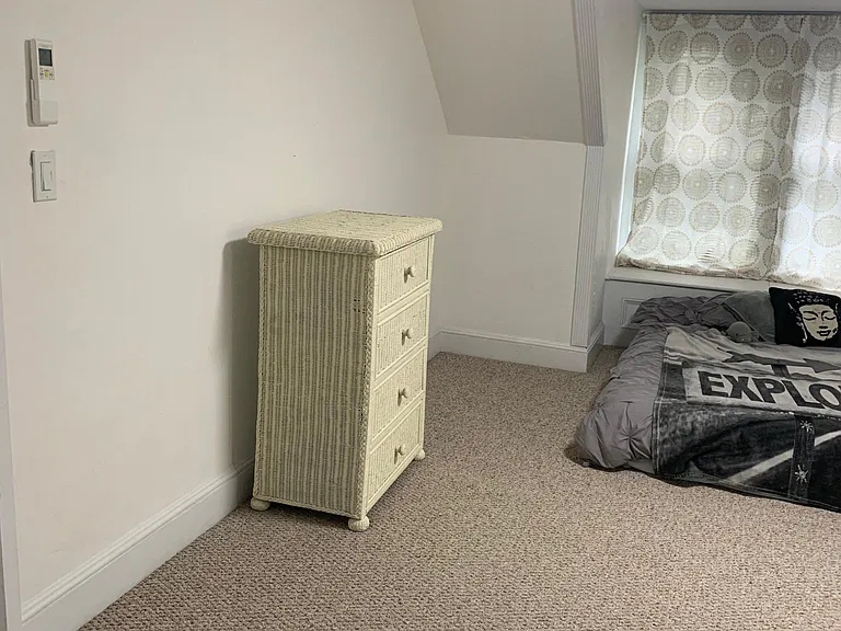 Entrance side of bedroom looking towards window seat area