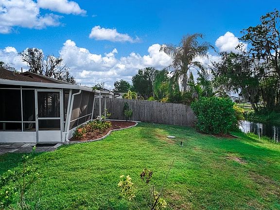 Backyard, sunroom, canal