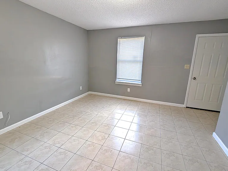 Spacious living room ready for your personal touch